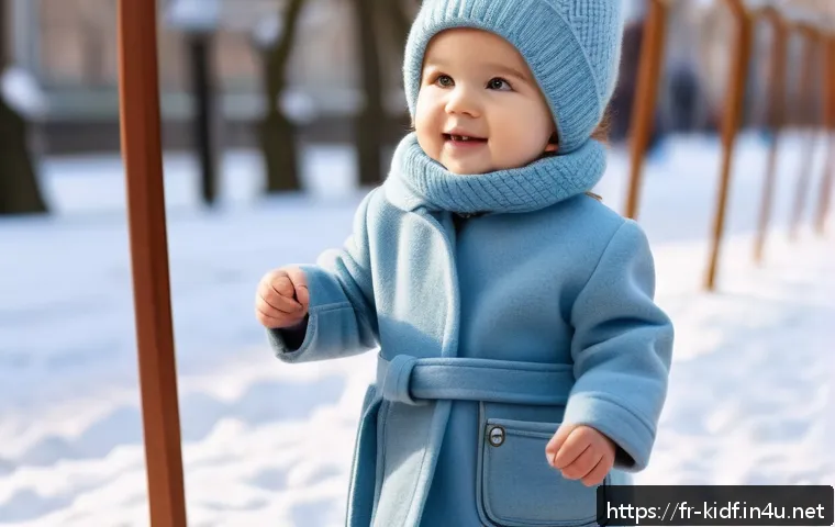 유아용 울코트 추천 - A cheerful young child wearing a soft, pastel blue merino wool coat with an integrated belt and a co...